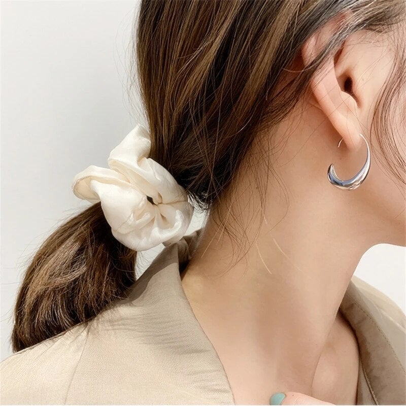 Elegante Ohrringe in Gold und Silber