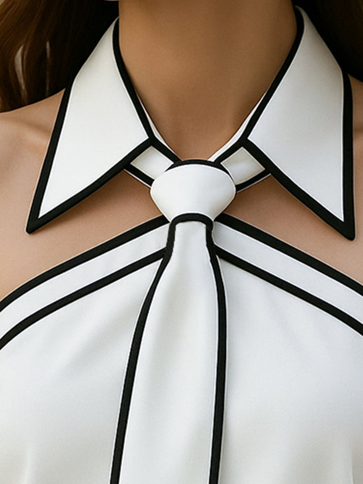 Elettra | Ärmellose Halterbluse mit Kontrastpaspel